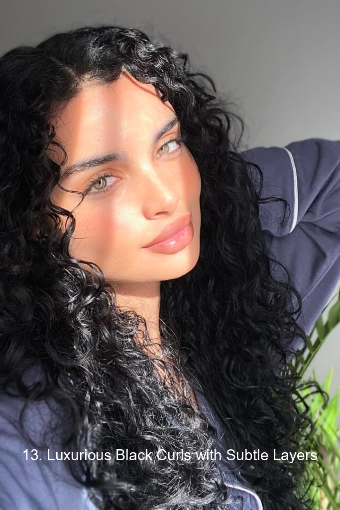 13. Luxurious Black Curls with Subtle Layers