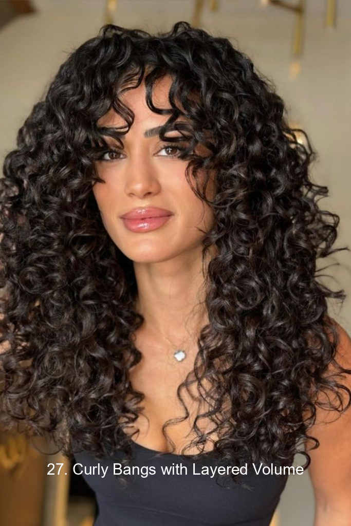 27. Curly Bangs with Layered Volume