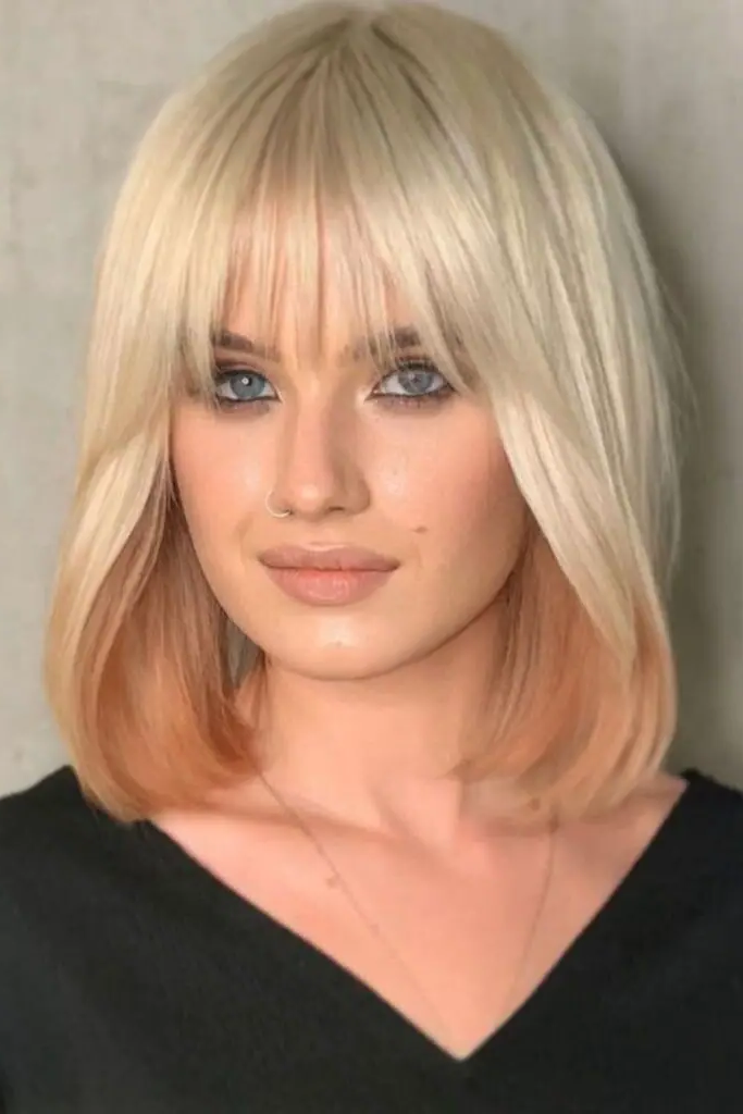 22. Lob with Wispy, Face-Framing Fringe